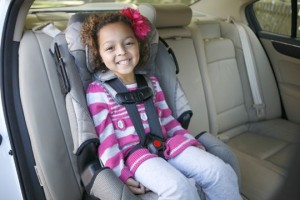 Child in a forward-facing car seat.