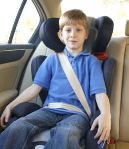 Child in high back booster seat.