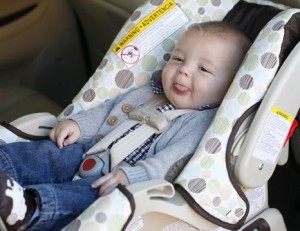 Infant in rear-facing only car seat.